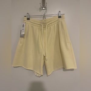 Size small yellow TNA Aritzia fleece shorts
